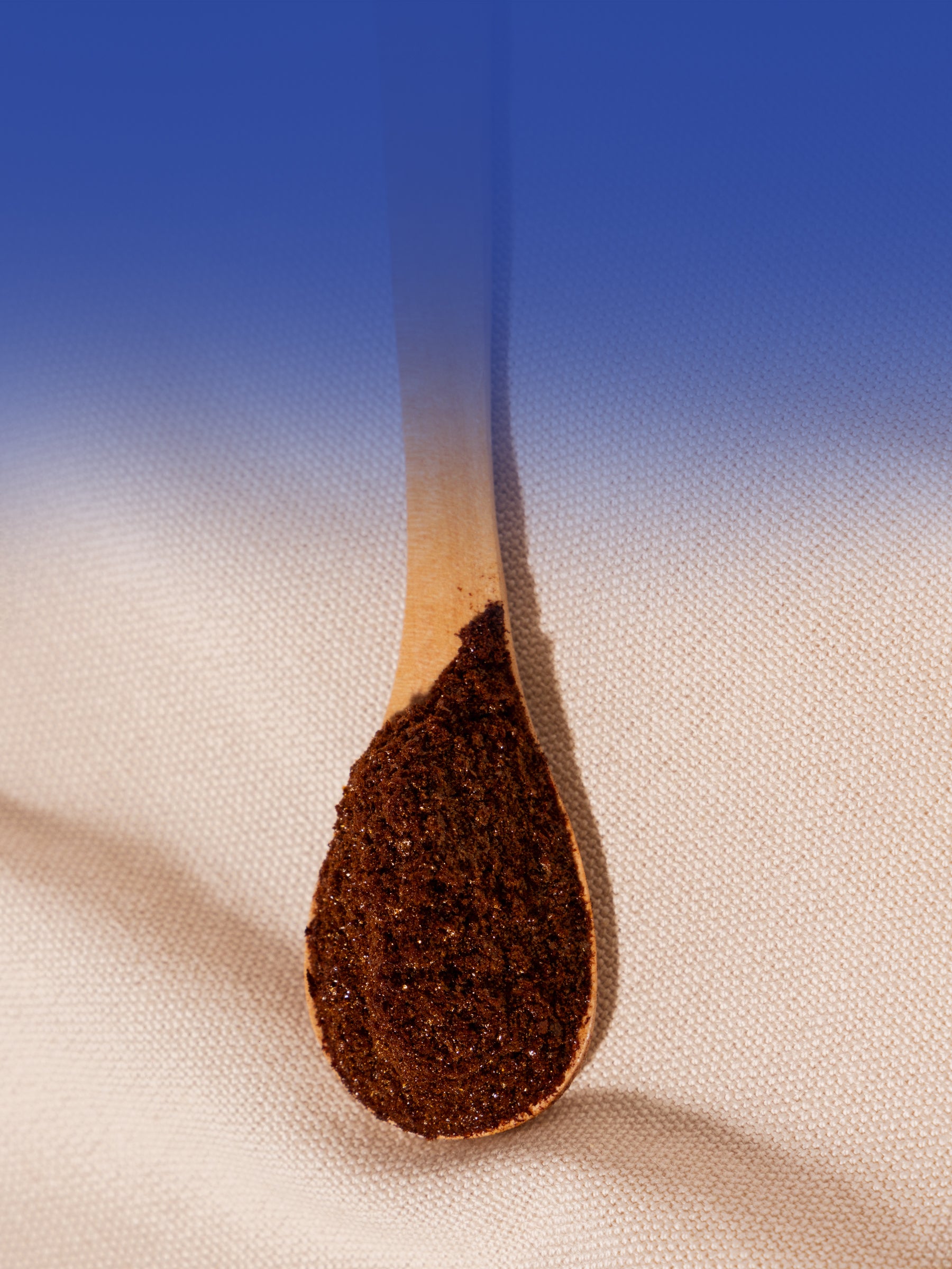 A wooden spoon with Compound's bean-free instant coffee