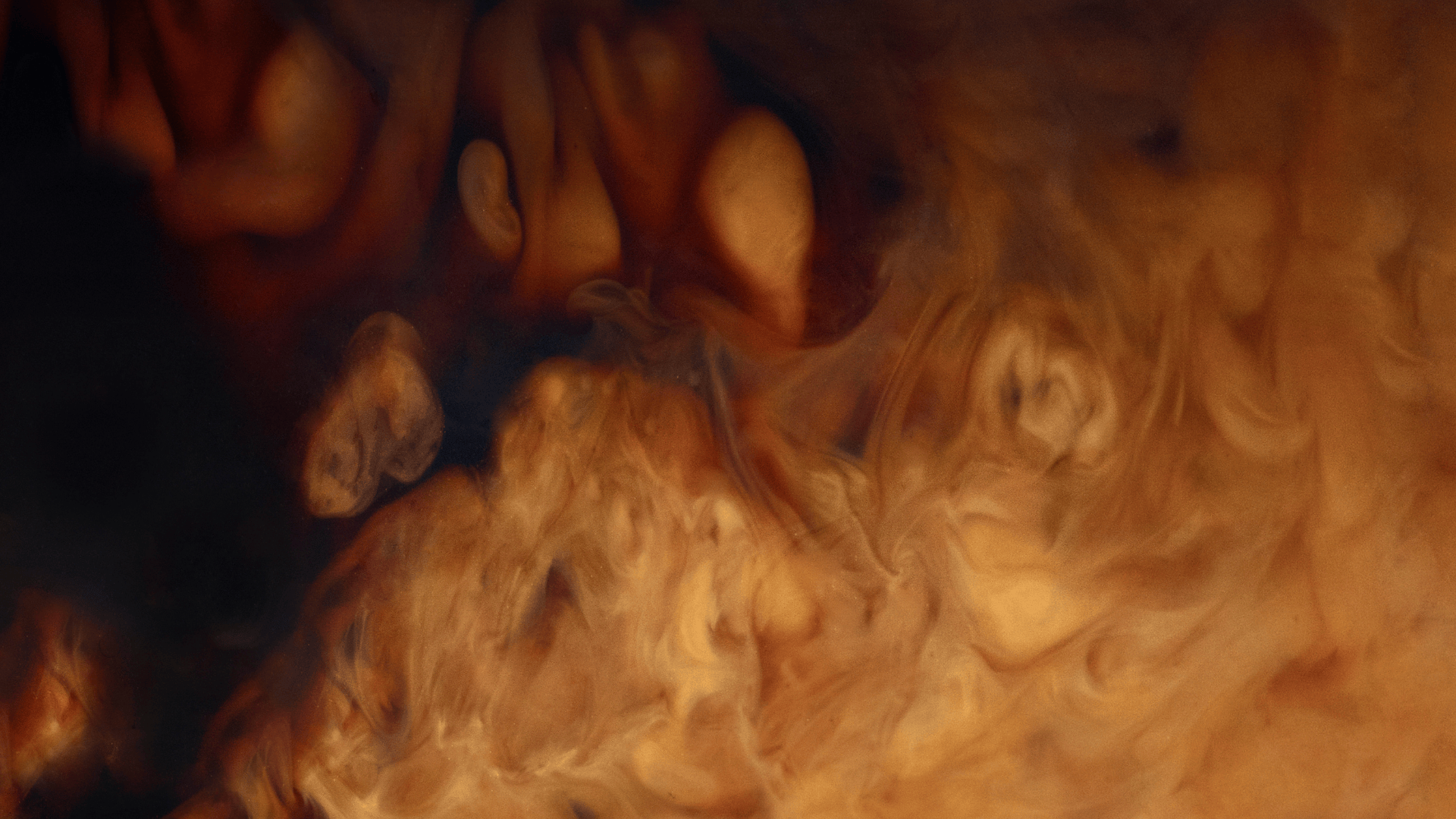 Black Coffee Close Up with Milk Swirl