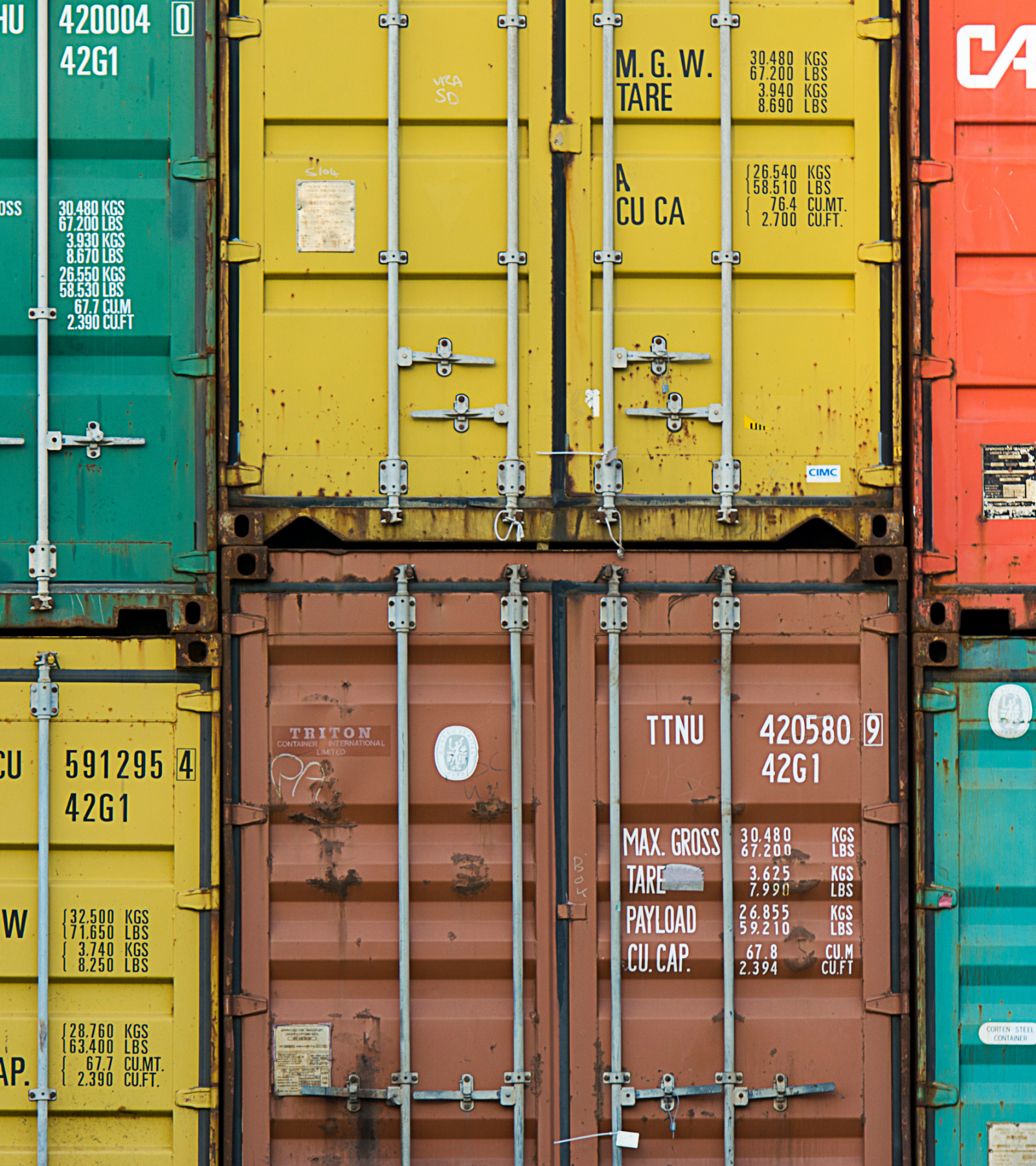 Close up of different colored shipping containers