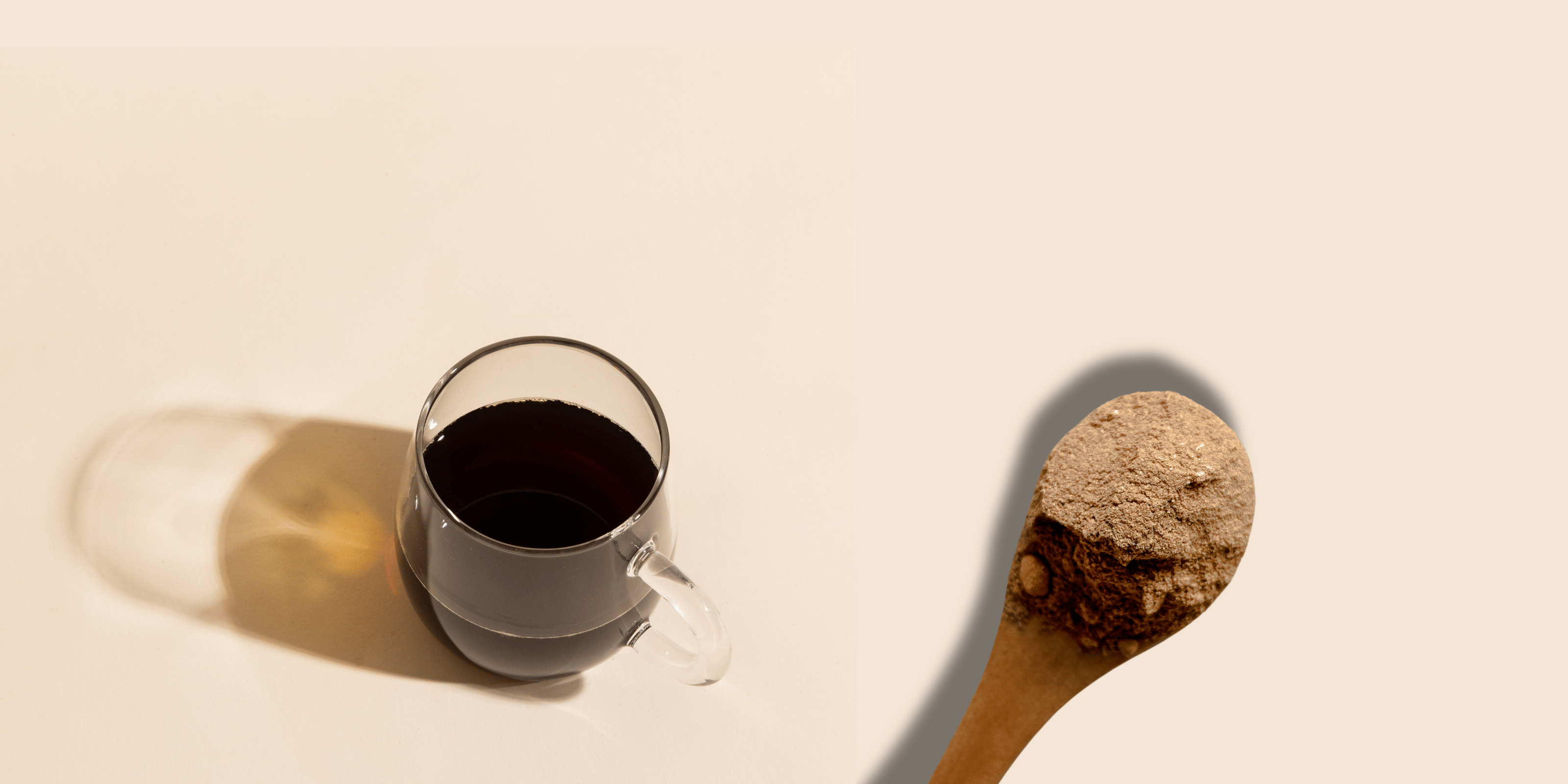 Compound’s bean-free coffee served in a clear cup, with the cocoa-free cocoa extender beside it